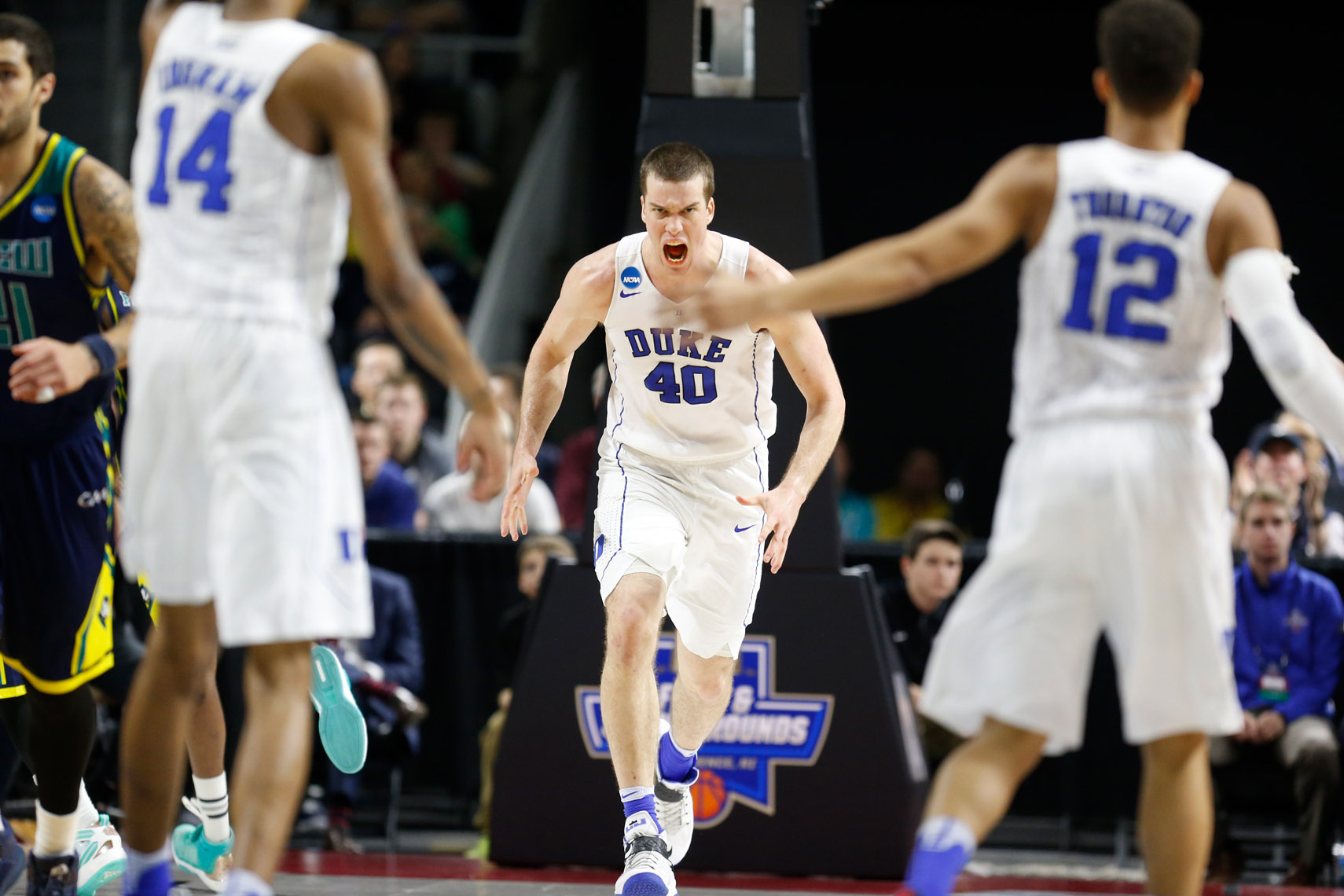 Duke center Marshall Plumlee reacts after scoring in an NCAA  tournament game.