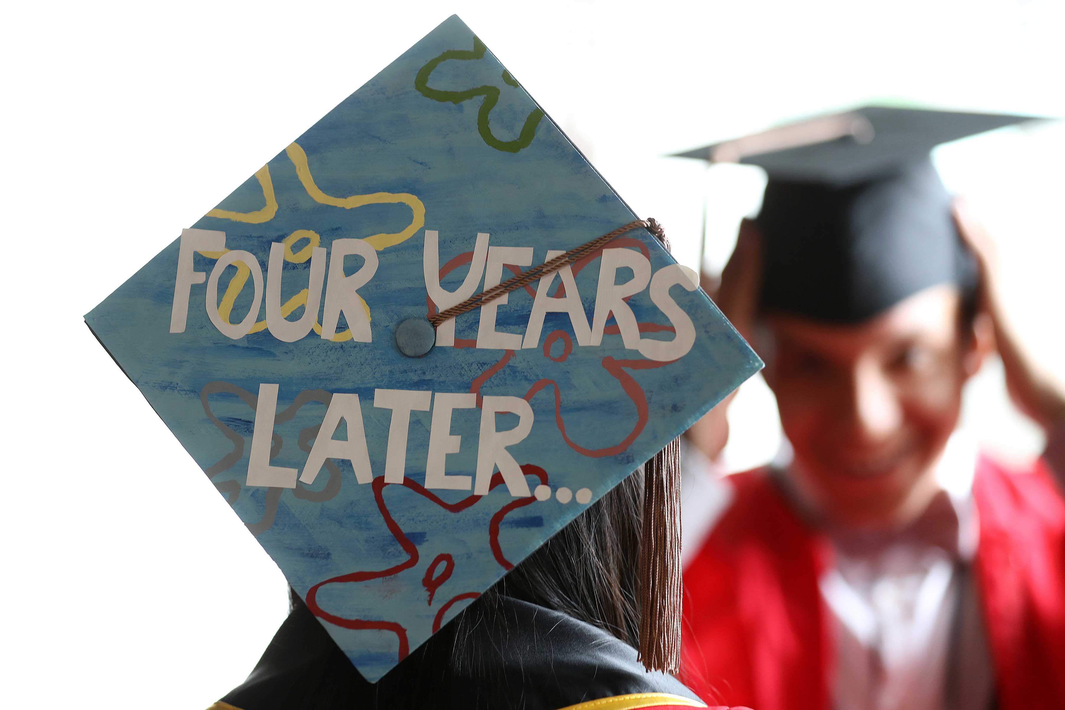 A message is shown on a mortar board before a Boston University Commencement