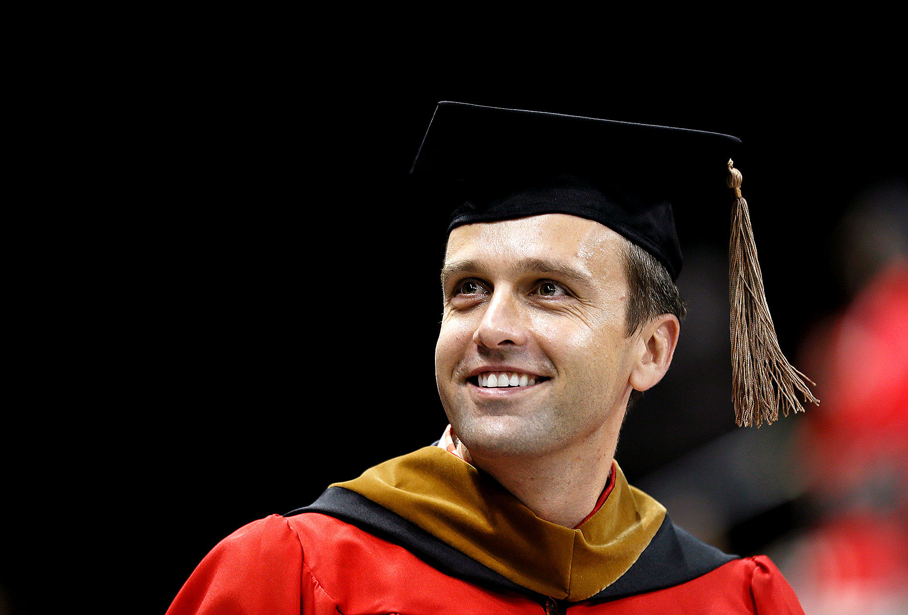 A Boston University MBA graduate searches the crowd for his family.