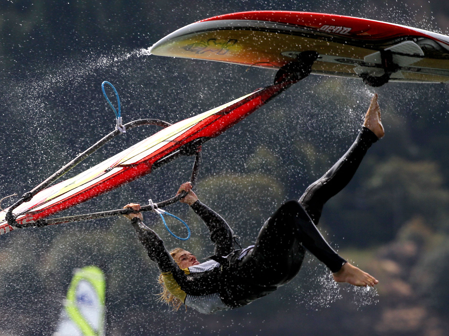 Water drips from the board as a windsurfer catches some air in the Columbia River.