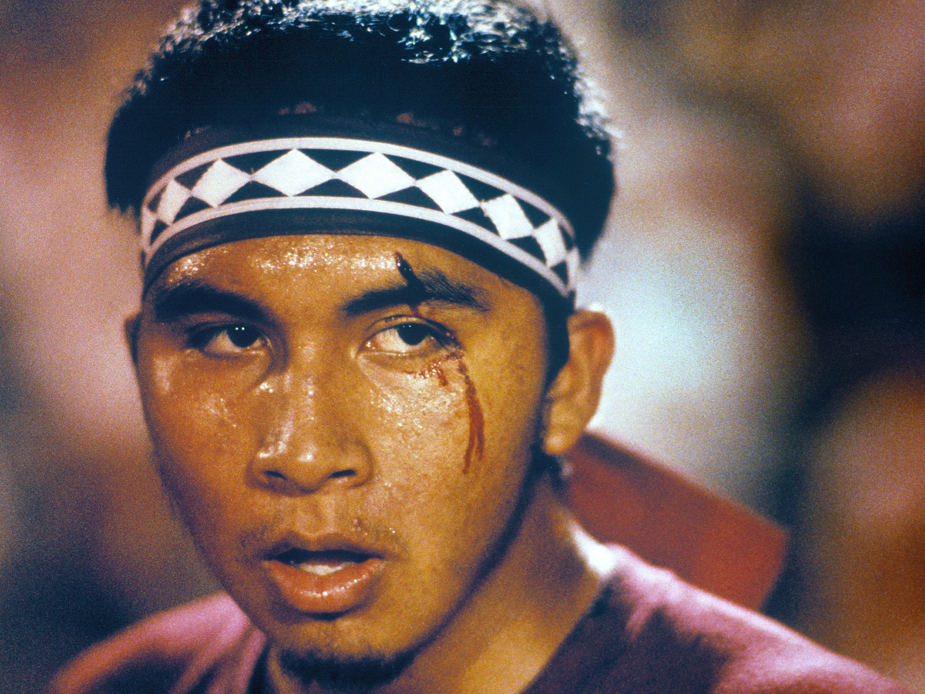 A member of the Choctaw tribe sports a cut over his eye during a stickball game.